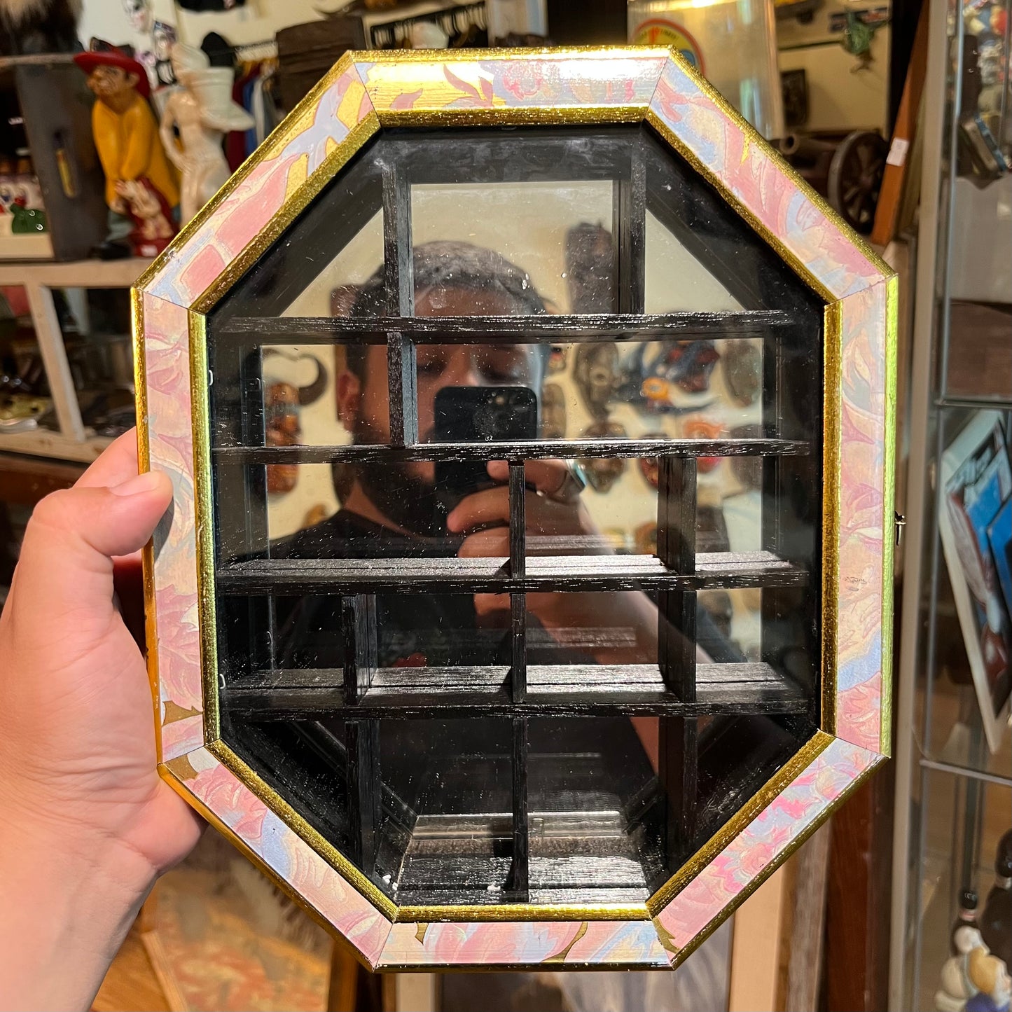 Vintage wall hanging octagon shaped curio cabinet.