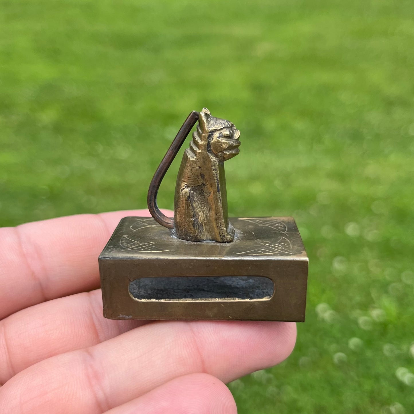 Vintage brass cat matchbook safe.