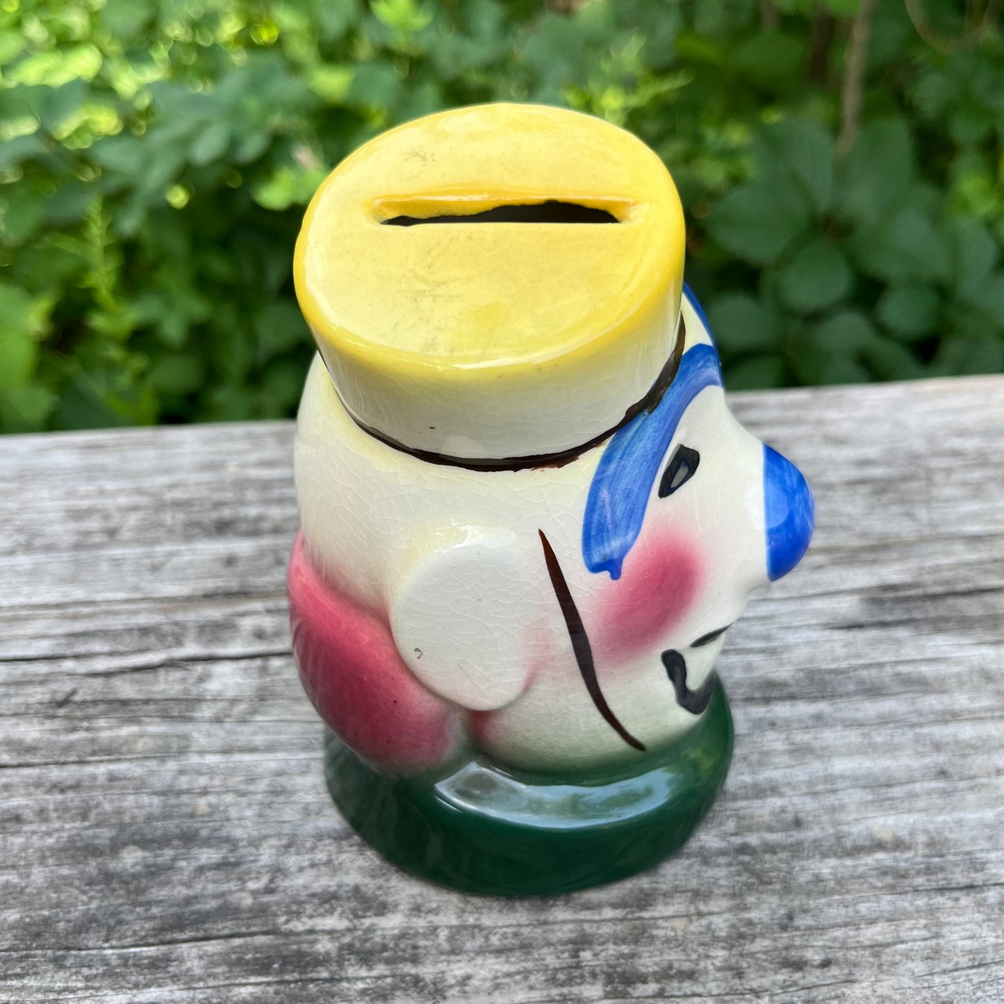 Vintage ceramic bellhop clown coin bank.