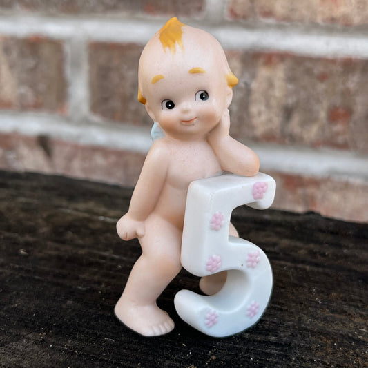 Vintage number 5 Kewpie.