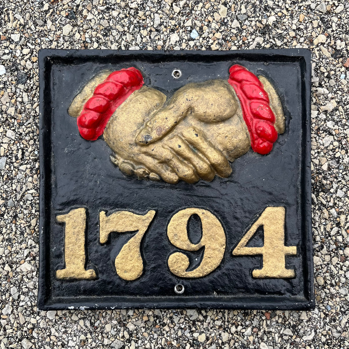Vintage cast iron Fire Mark insurance plaque.