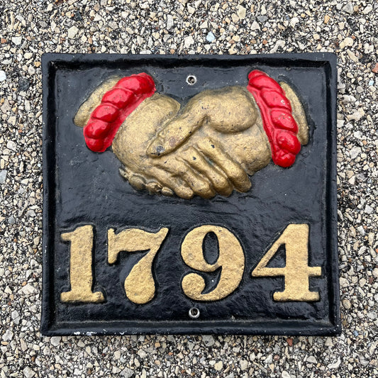 Vintage cast iron Fire Mark insurance plaque.