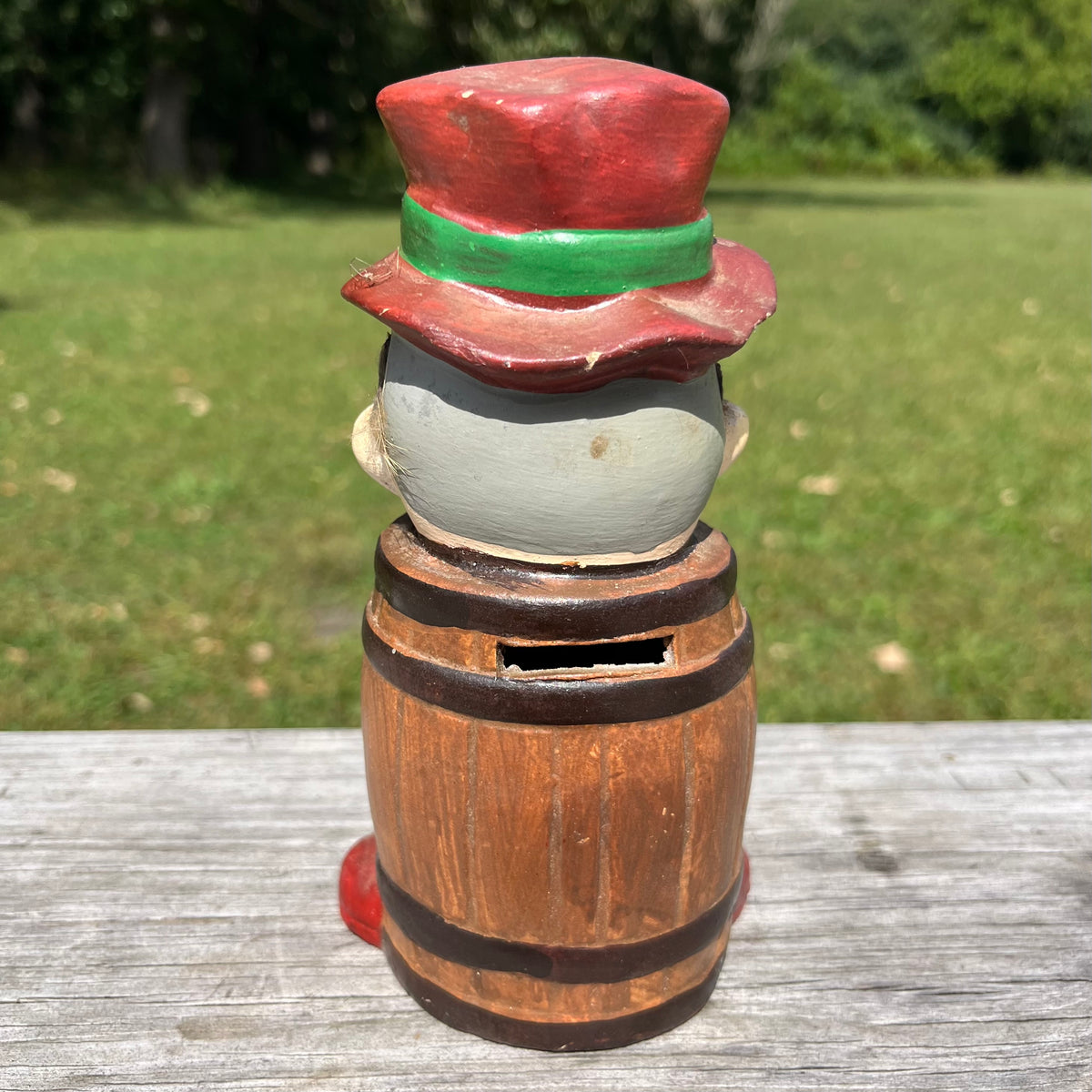 Vintage ceramic barrel man coin bank.
