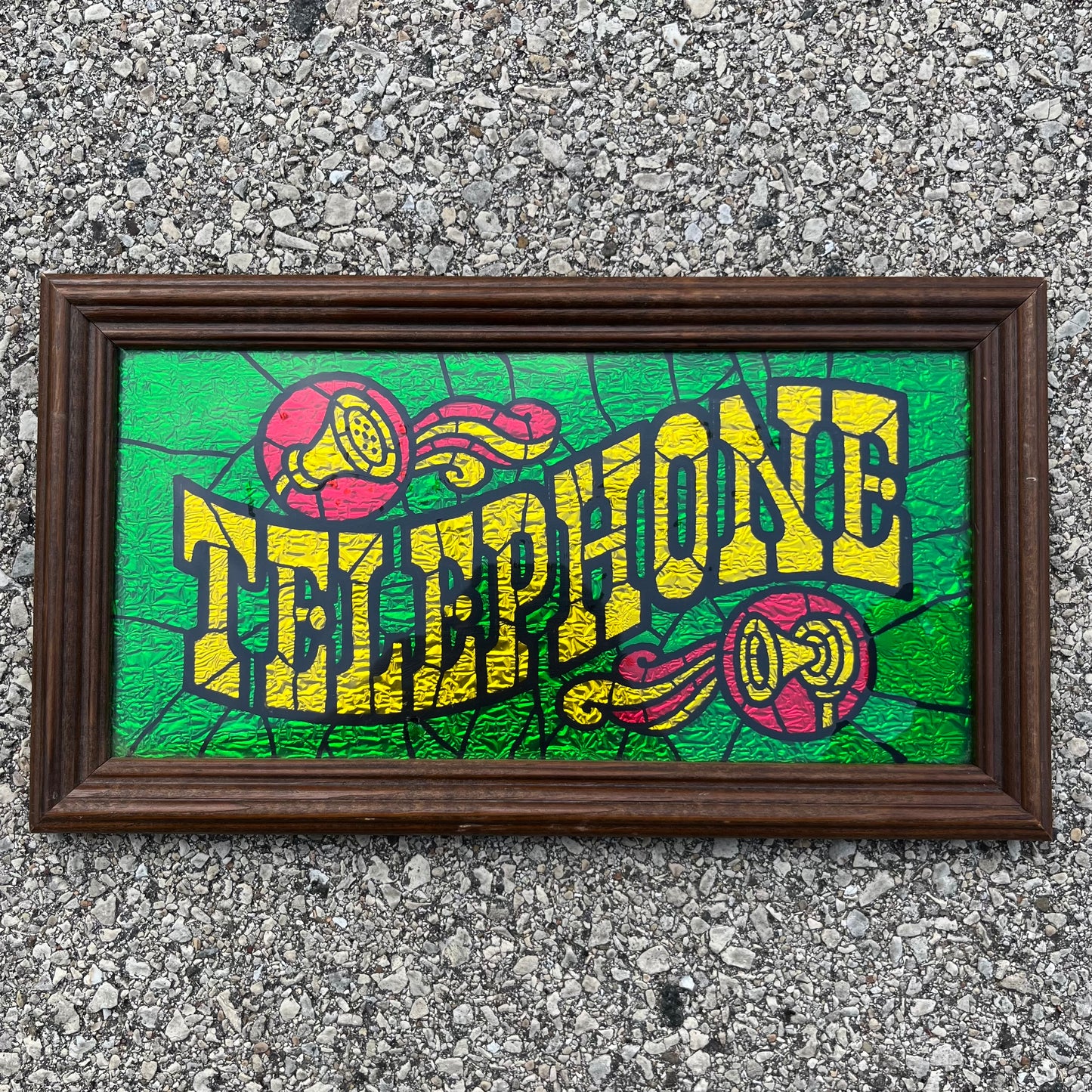 Vintage foil art “Telephone” sign.