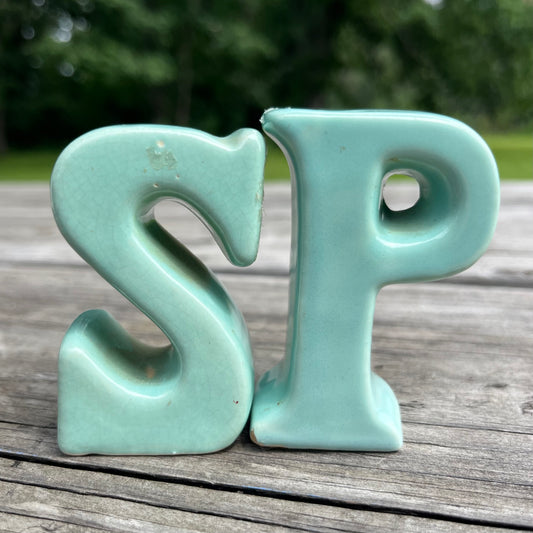 Vintage “SP” salt n’ pepper shakers.
