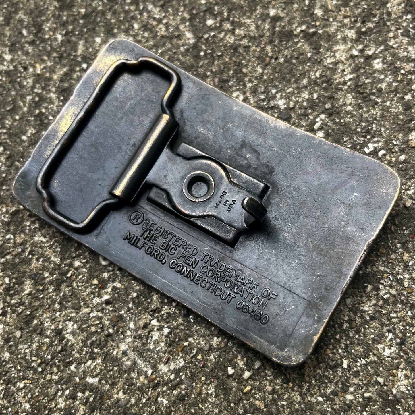 1980s “Flick my Bic” belt buckle.