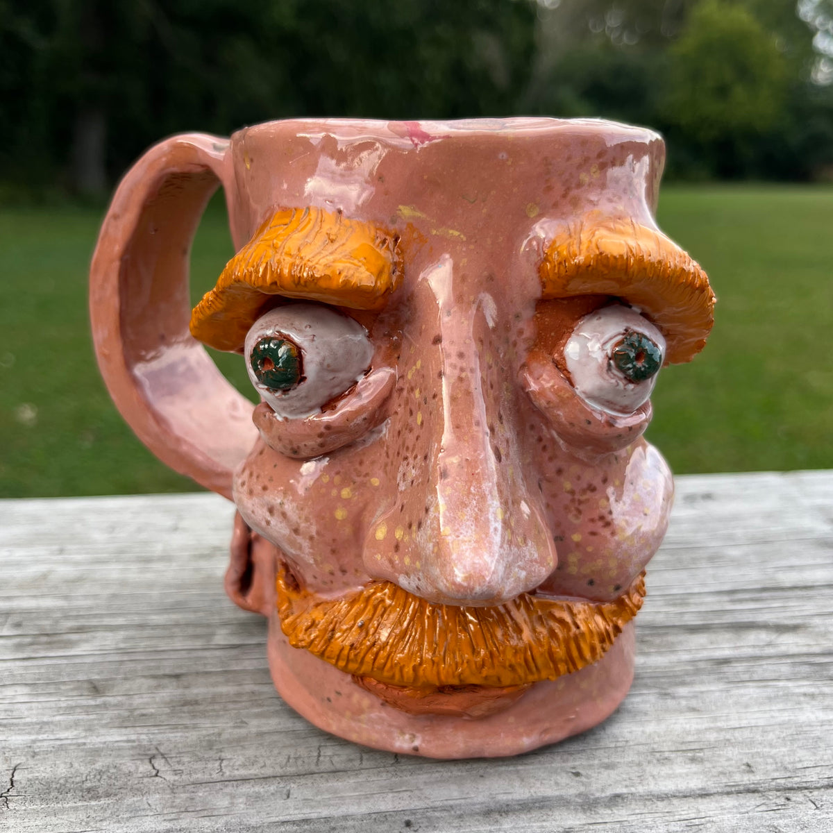 Vintage clay face mug.