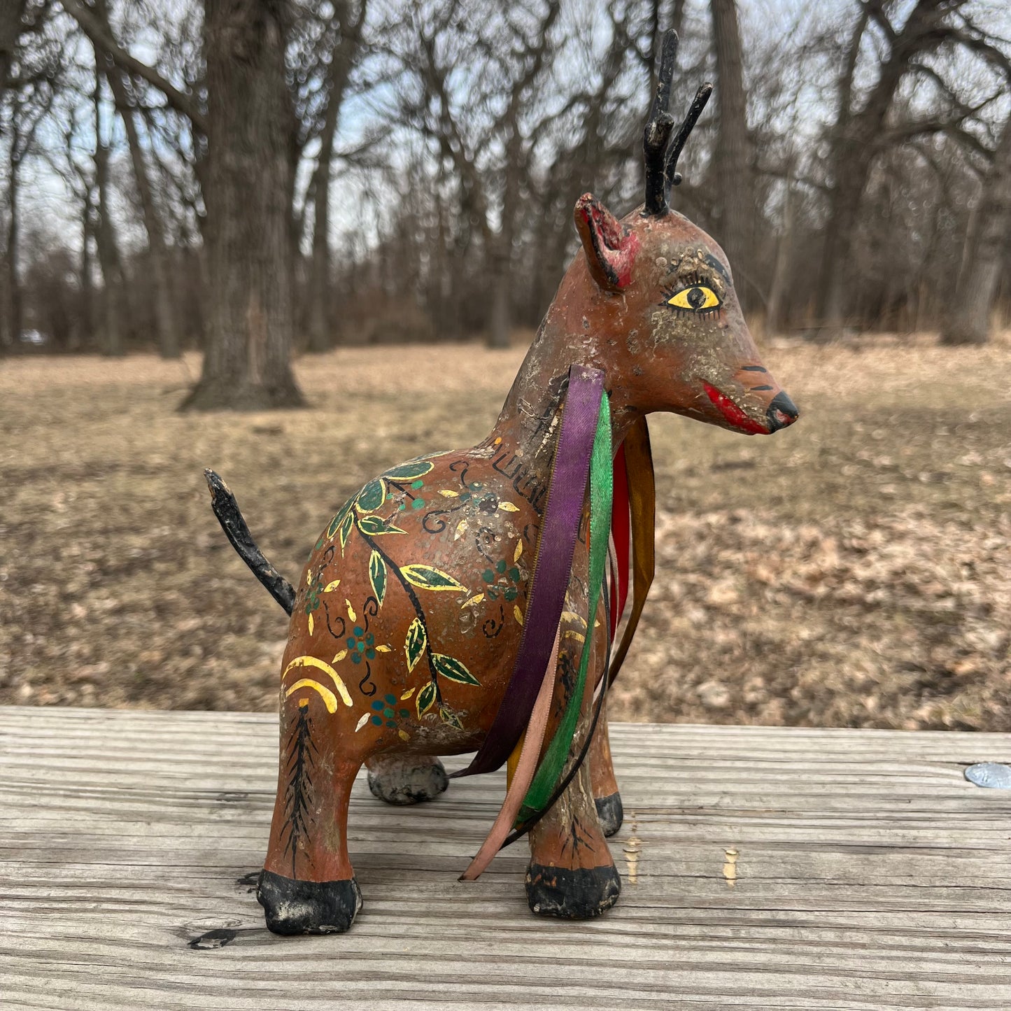 Hand crafted deer gourd maraca.