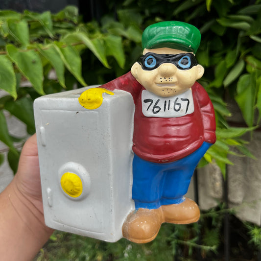 Vintage Burglar coin bank.