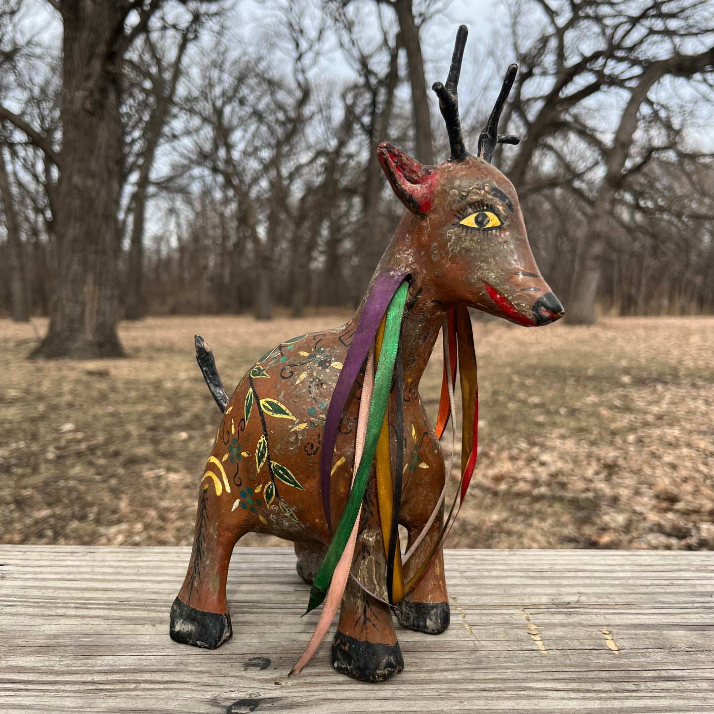 Hand crafted deer gourd maraca.