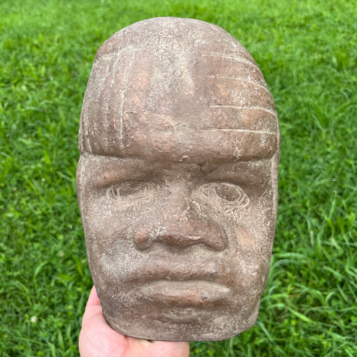 Vintage clay souvenir Olmec mask.