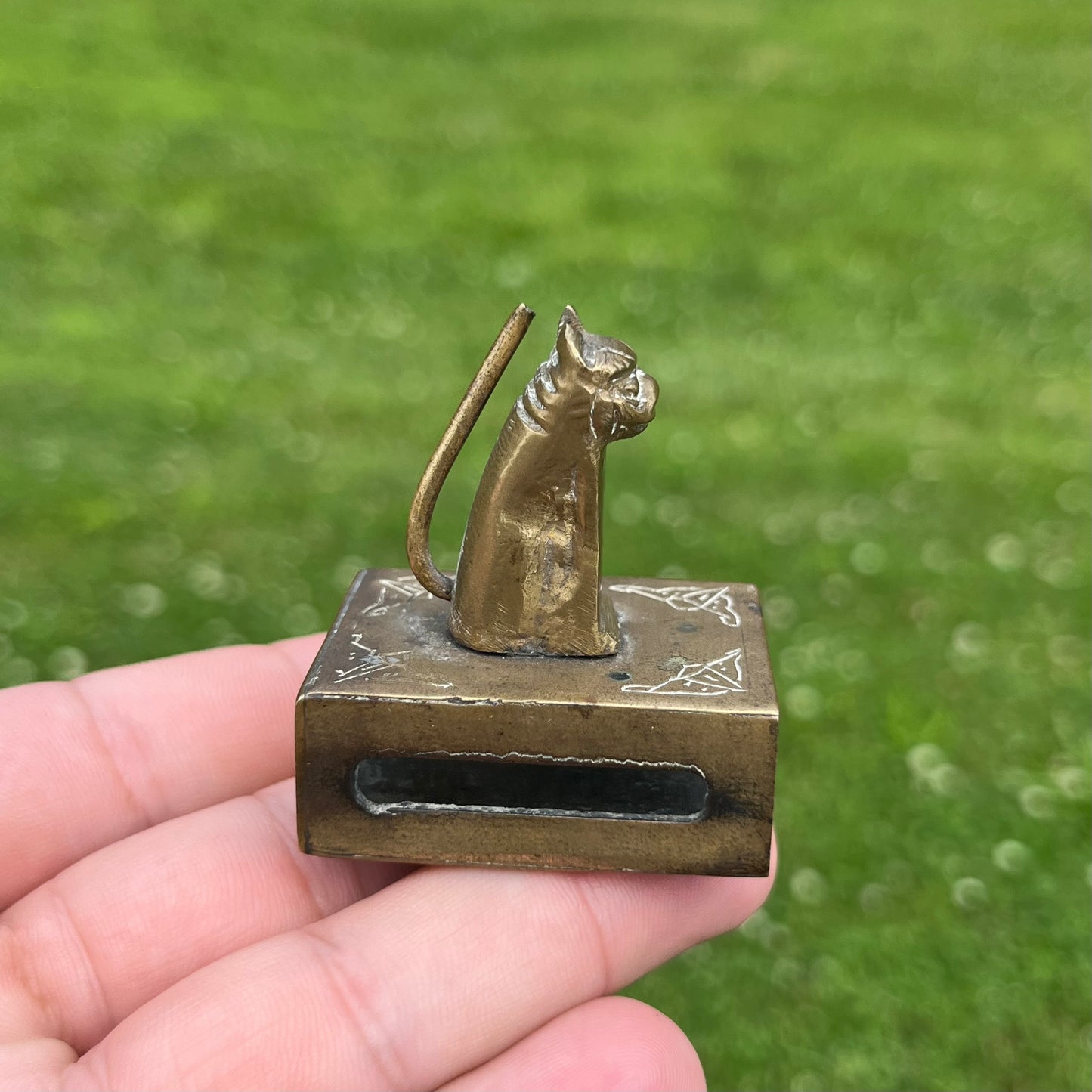 Vintage brass cat matchbook safe.