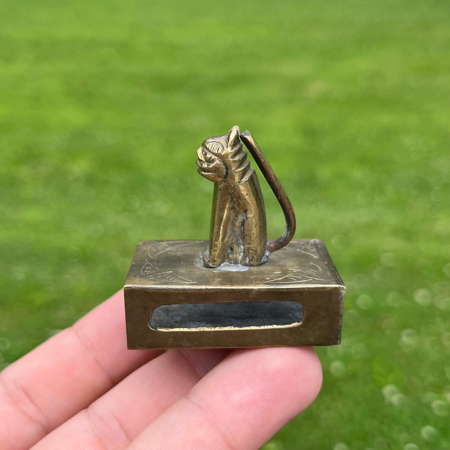 Vintage brass cat matchbook safe.