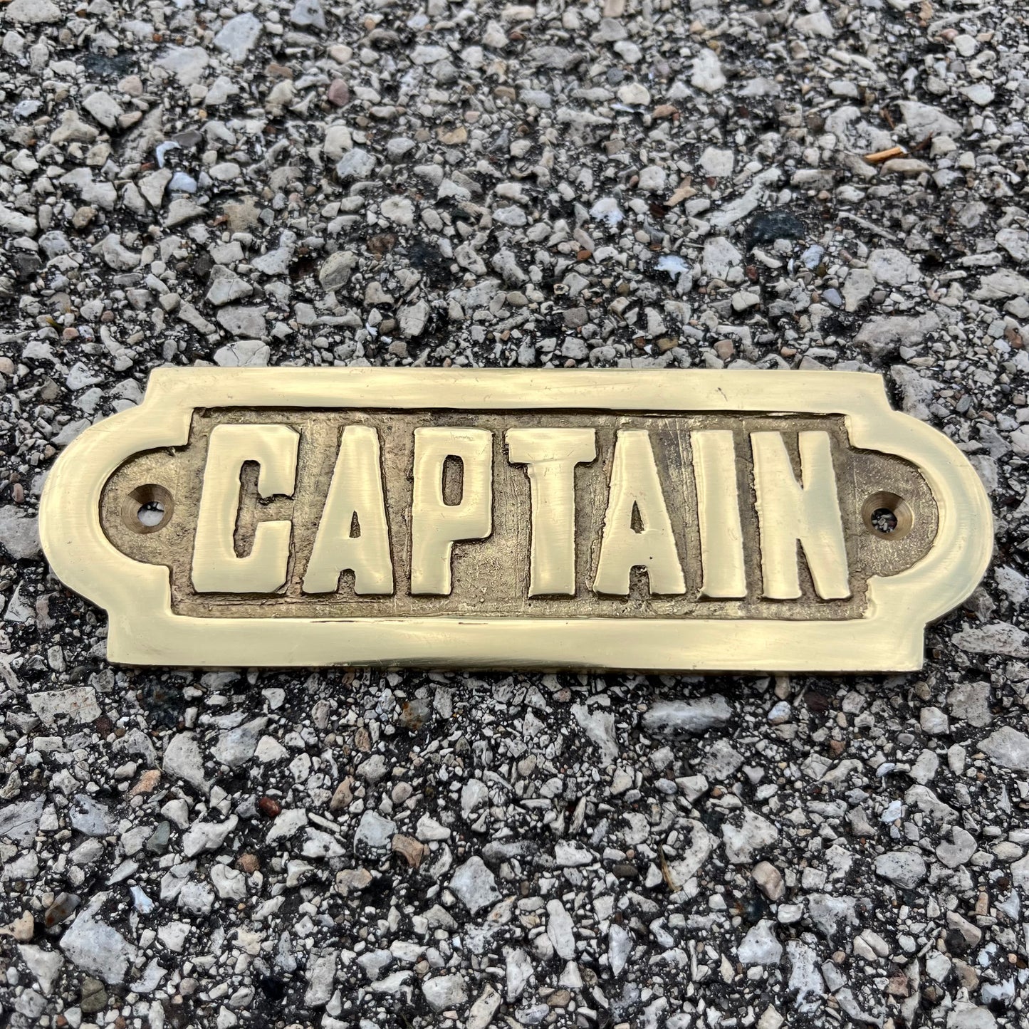 Vintage brass “captain” plaque.