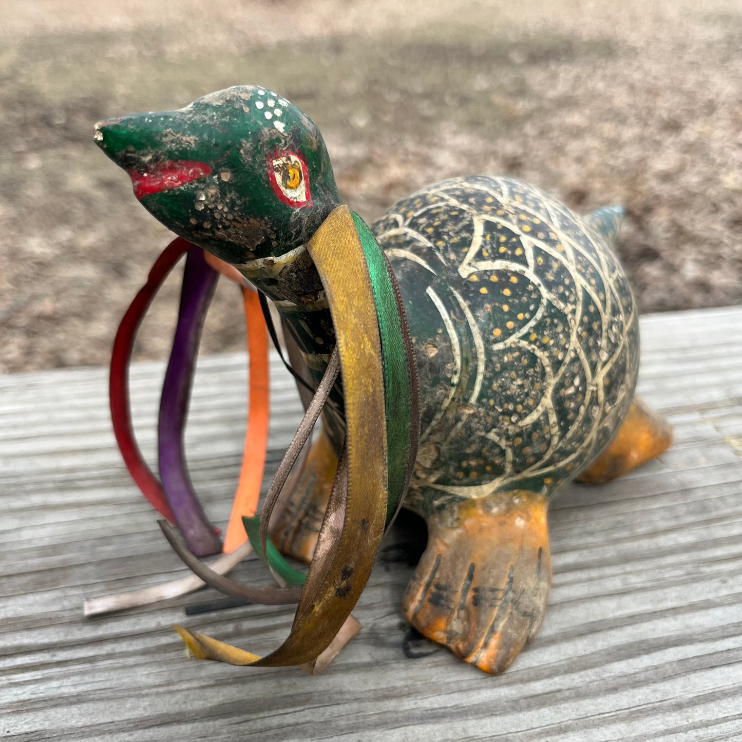 Hand crafted turtle gourd maraca.