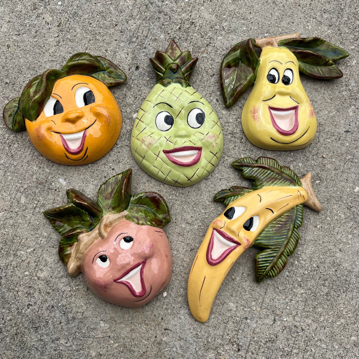 1970s Ceramic wall hanging fruity faces set.