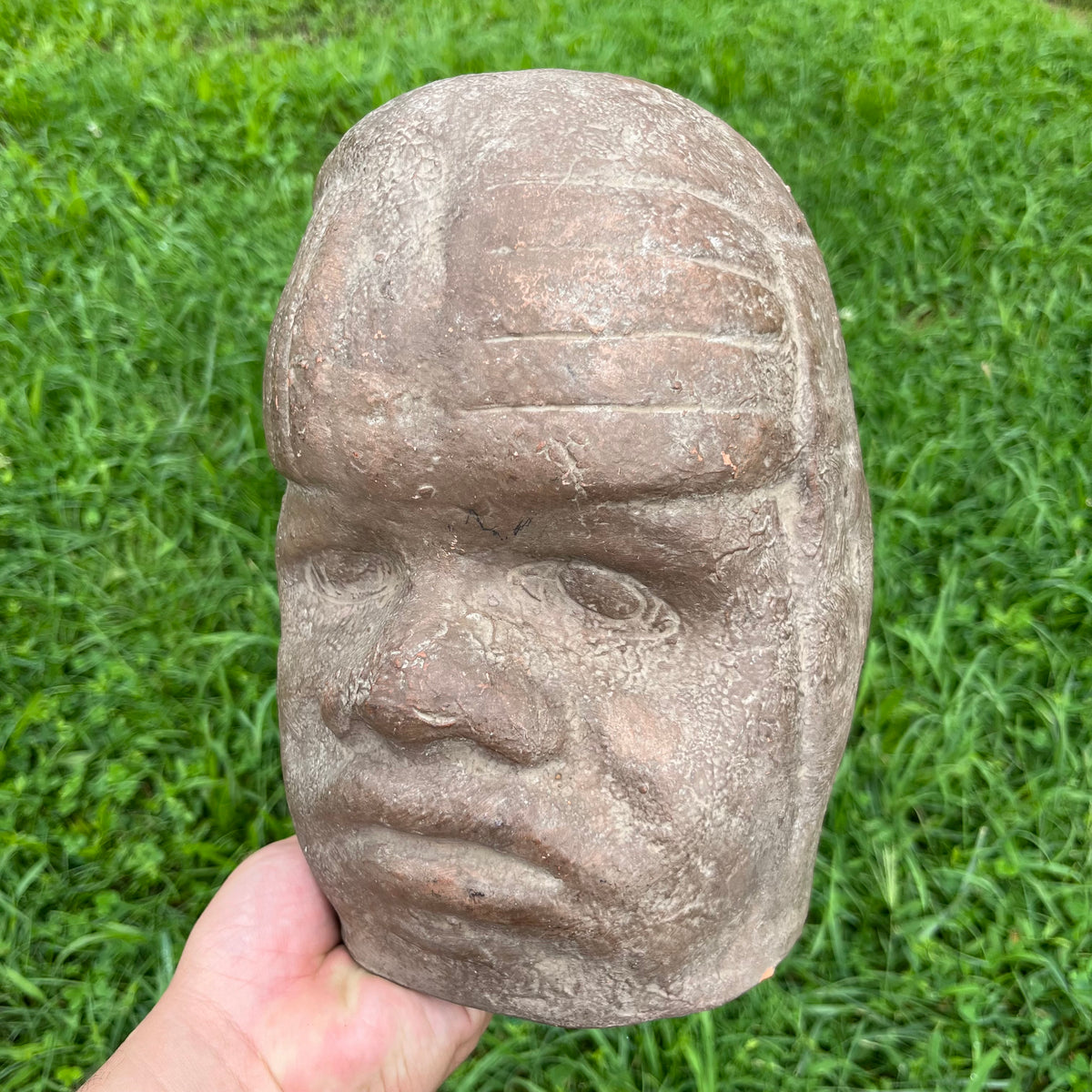 Vintage clay souvenir Olmec mask.