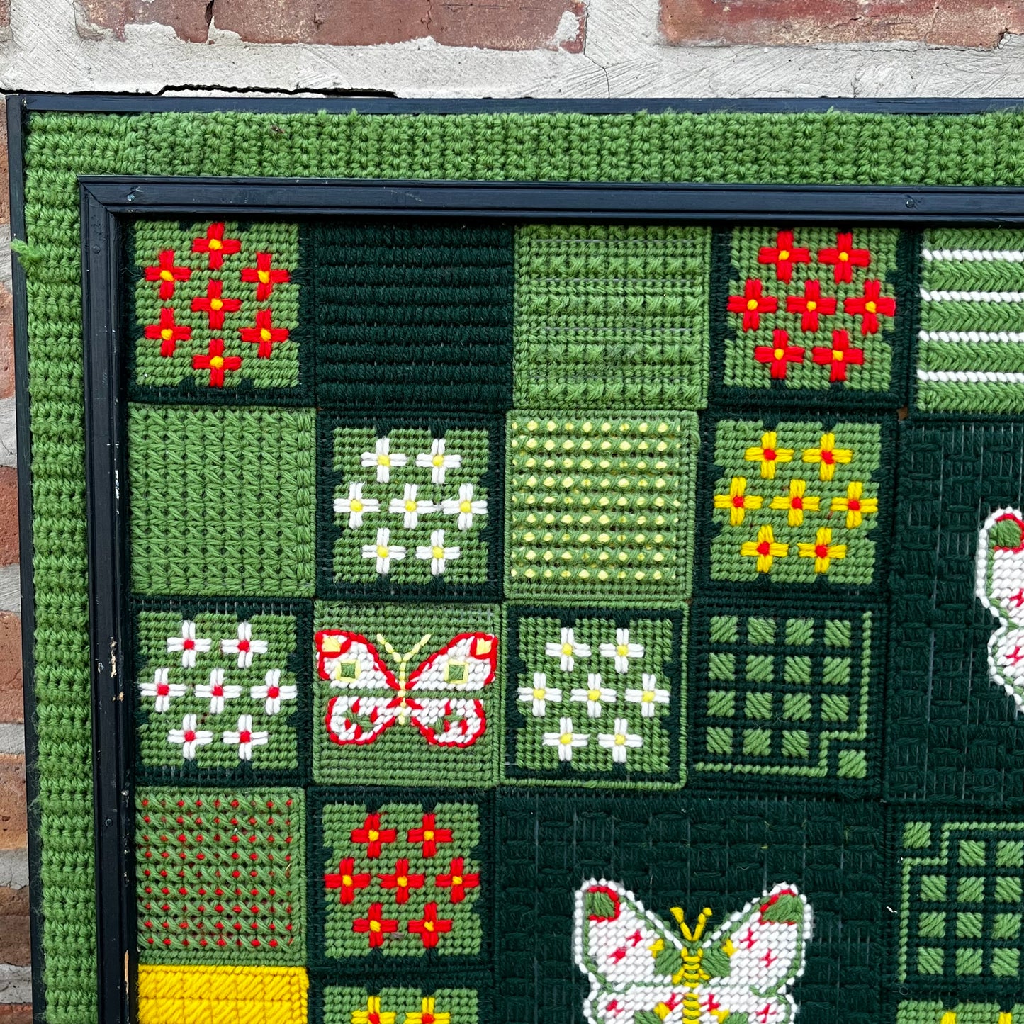 Framed 1970s Buttetfly needlepoint.