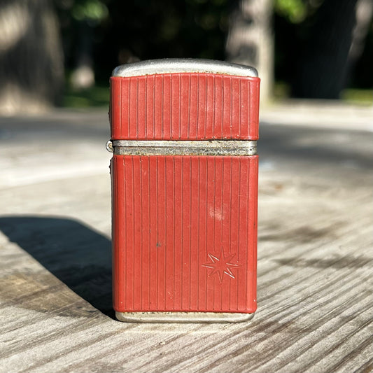 1960s Trimlite Champ flip lighter.