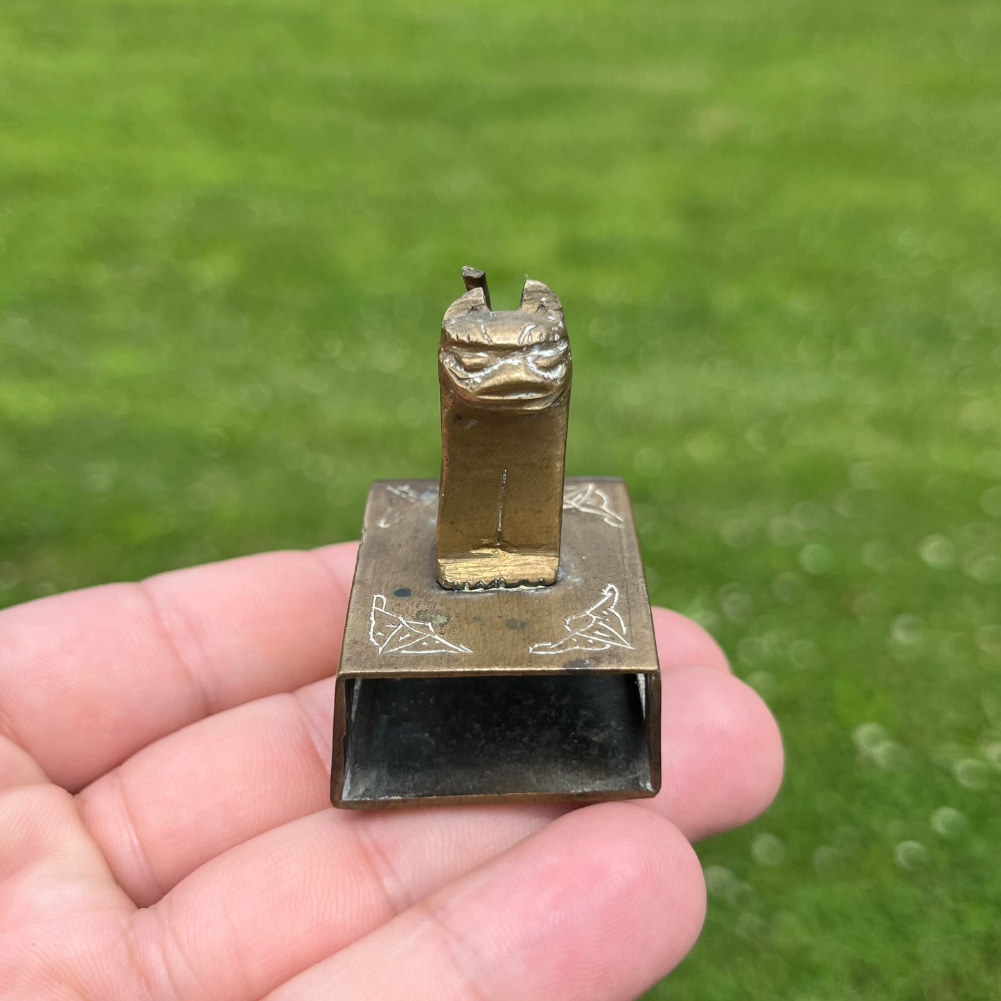 Vintage brass cat matchbook safe.