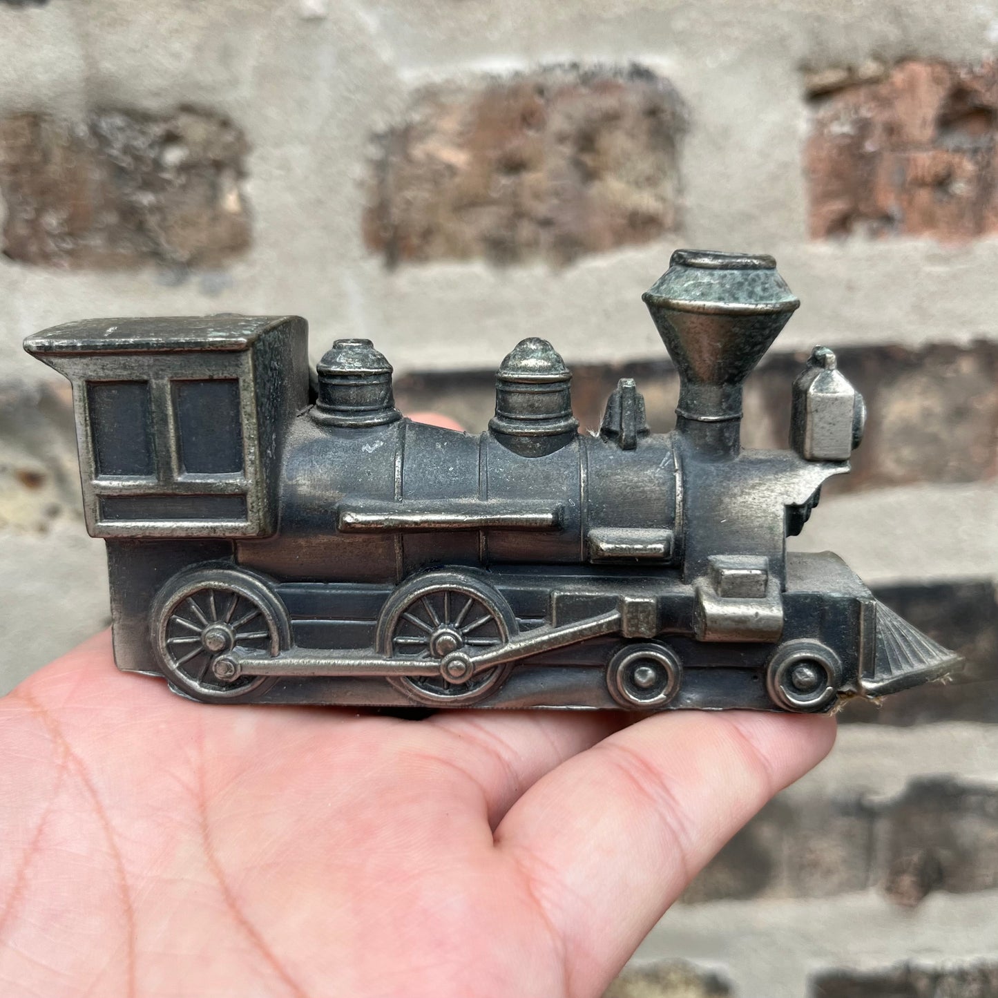 Vintage pewter train pipe holder.