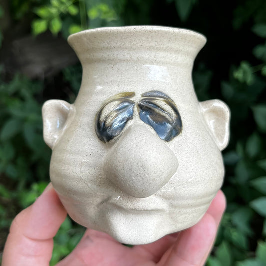 Vintage Peter Petrie stoneware egg seperator.