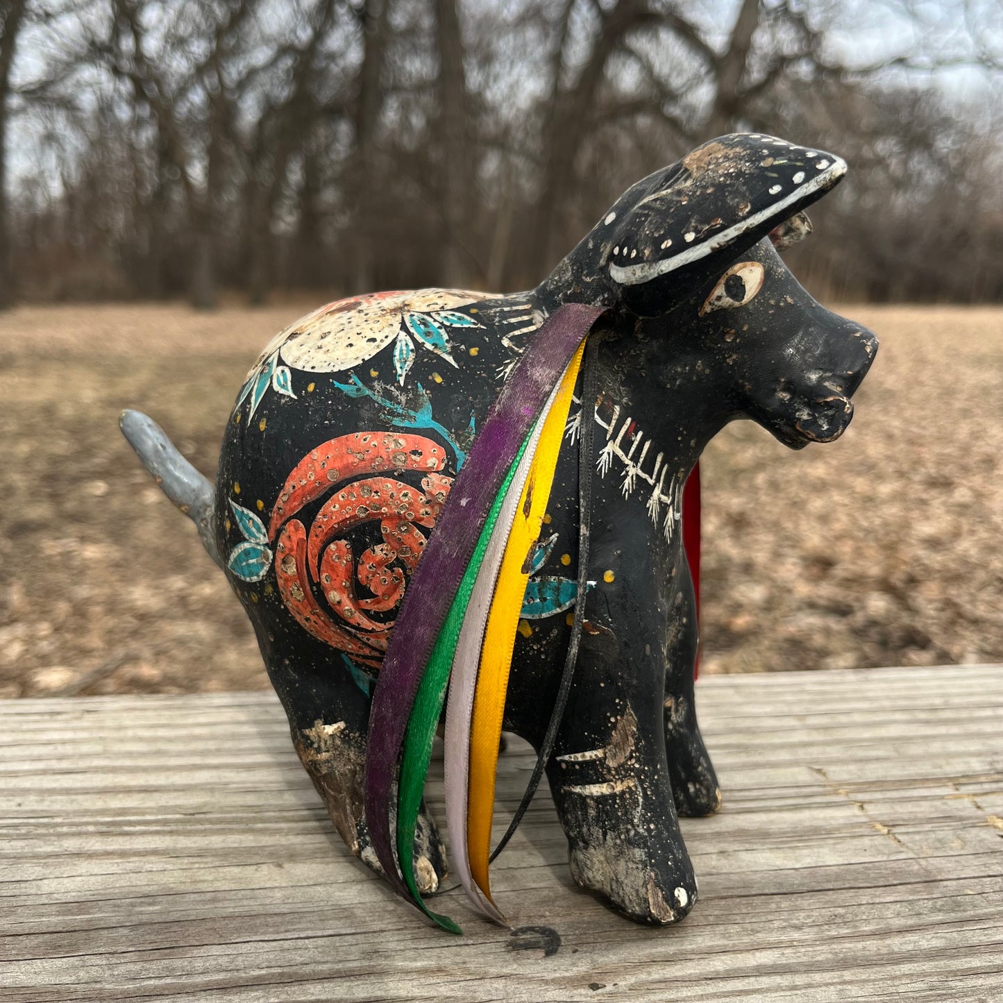 Hand crafted boar gourd maraca.