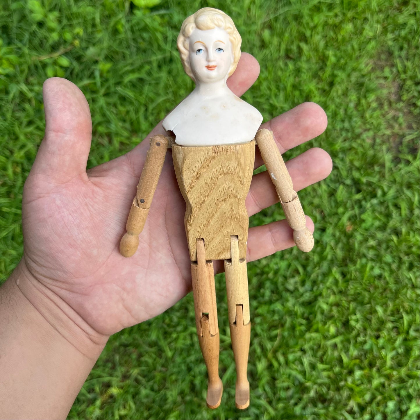 Vintage peg body bisque doll.