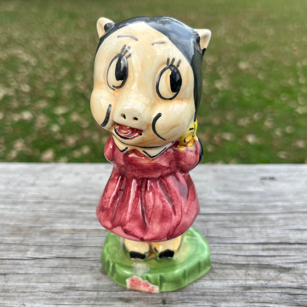 Vintage ceramic Petunia pig decanter.
