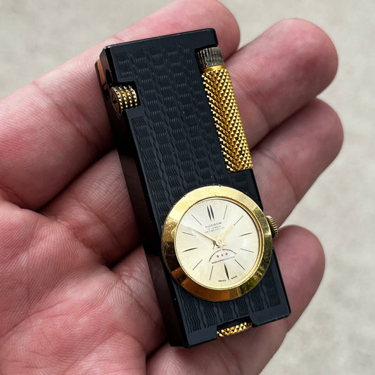 1950s Penguin Cygnus clock lighter.