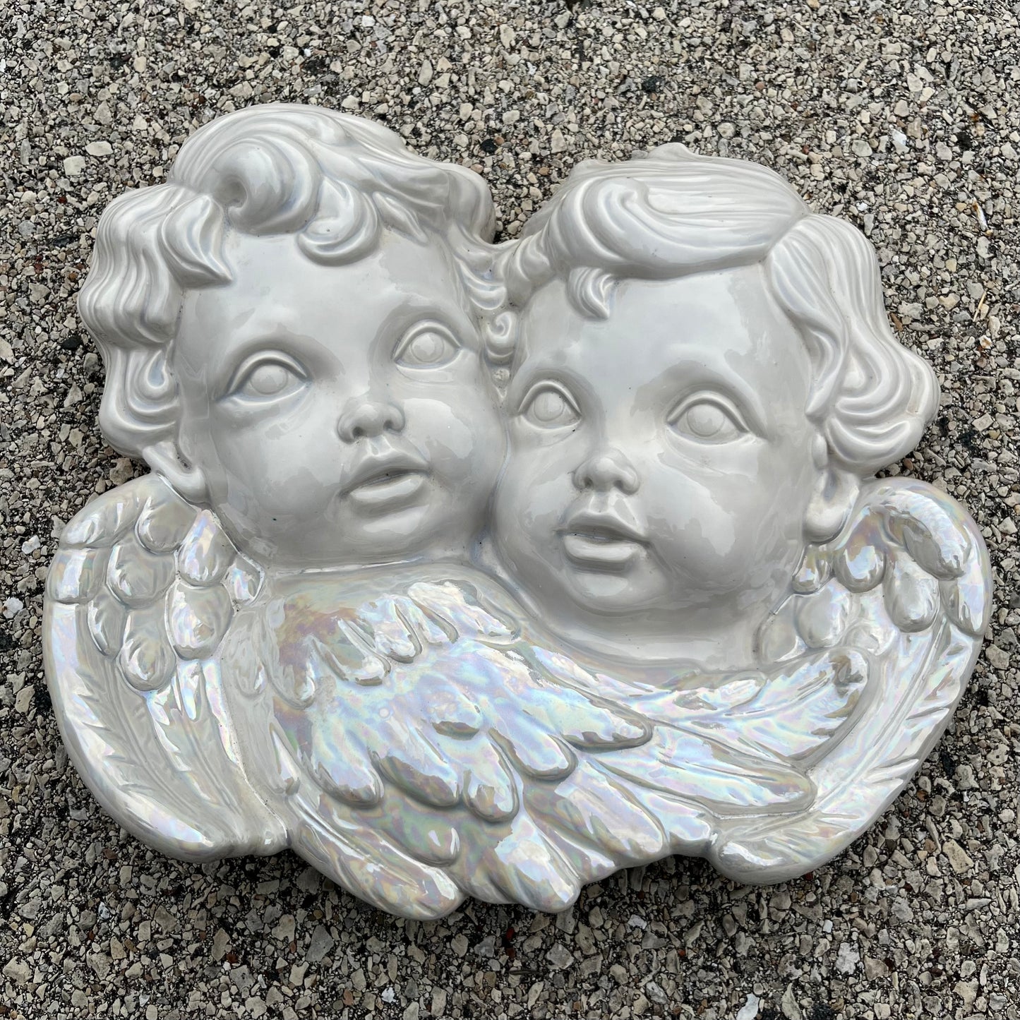 1984 Iridescent ceramic cherubs.