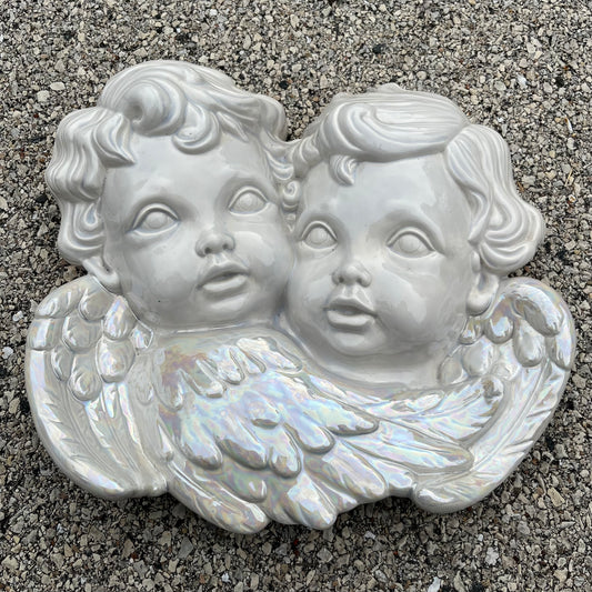1984 Iridescent ceramic cherubs.