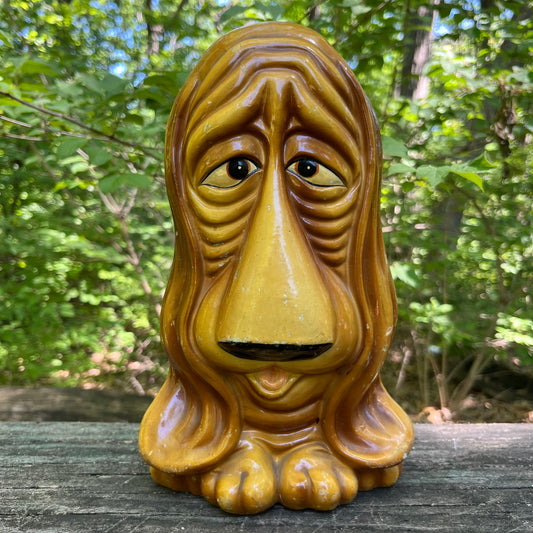 Vintage sad pup coin bank.