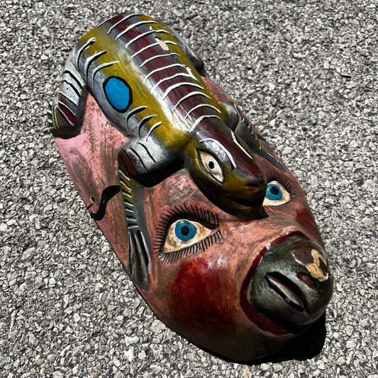 Vintage decorative lizard mask.