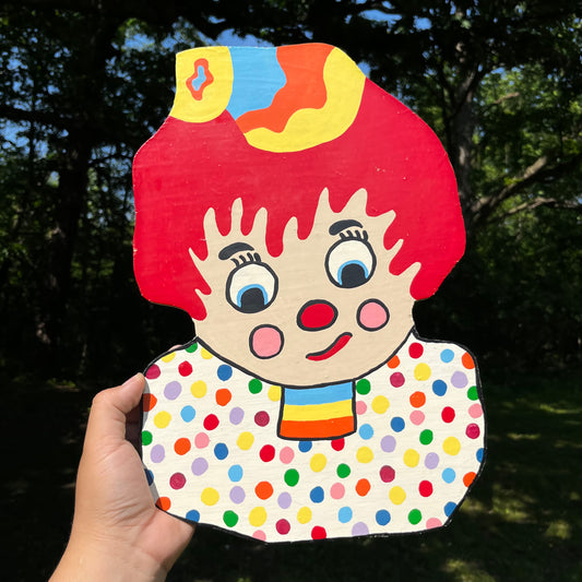 Vintage hand crafted wooden clown boy.