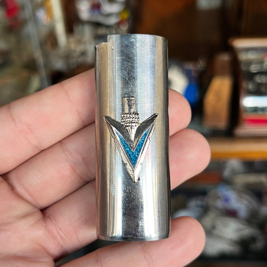 1980s Arrowhead lighter sleeve.