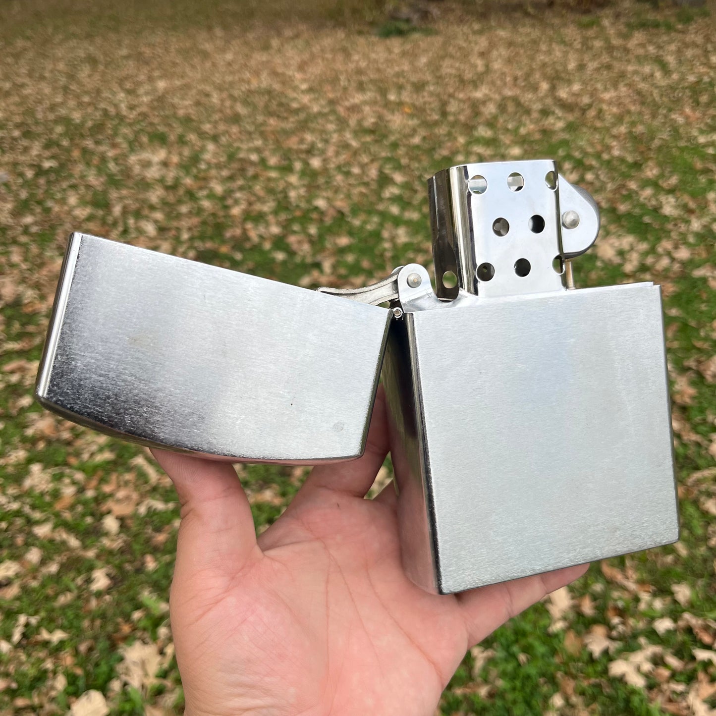 Vintage oversized flip lighter.