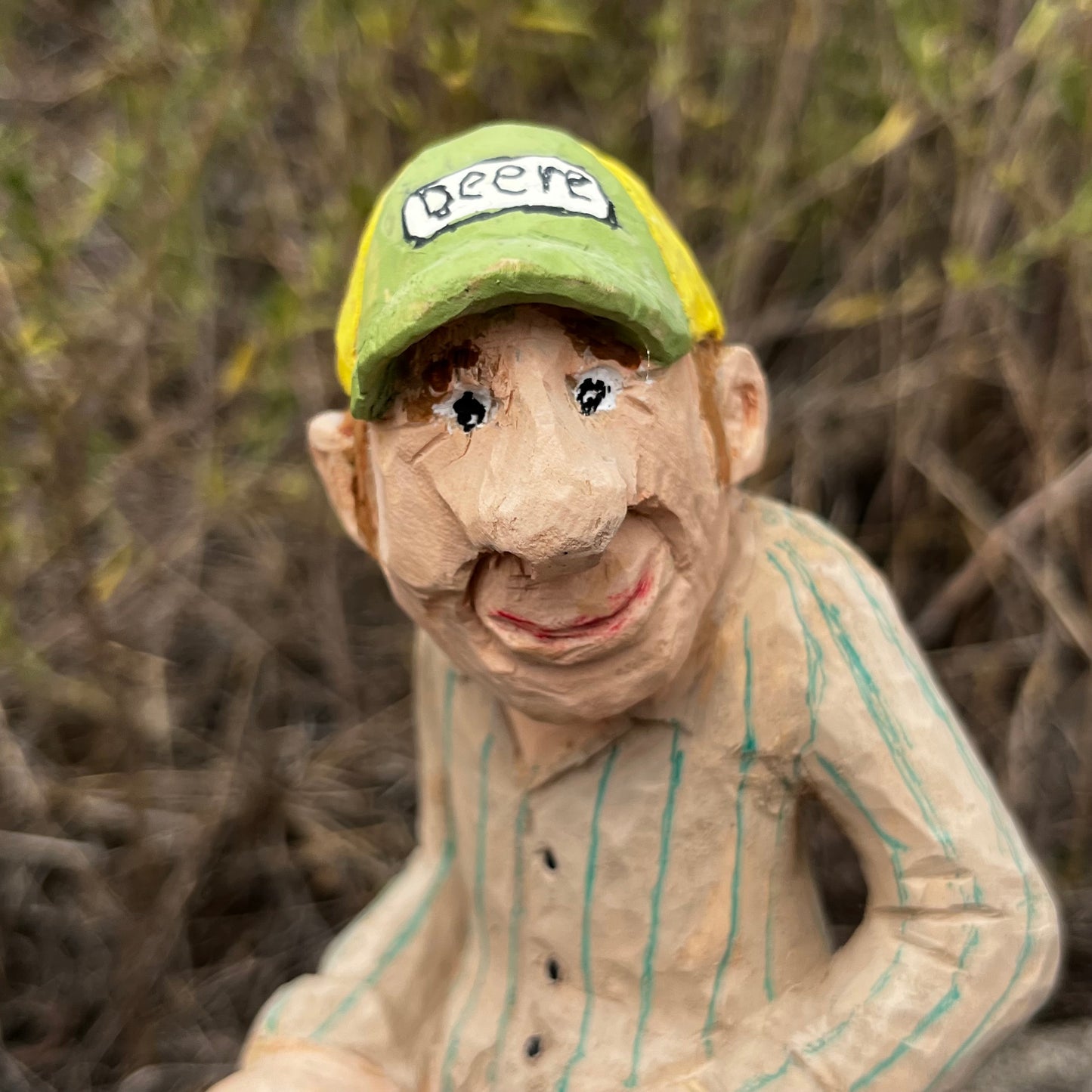 2021 Hand carved gas station attendant.