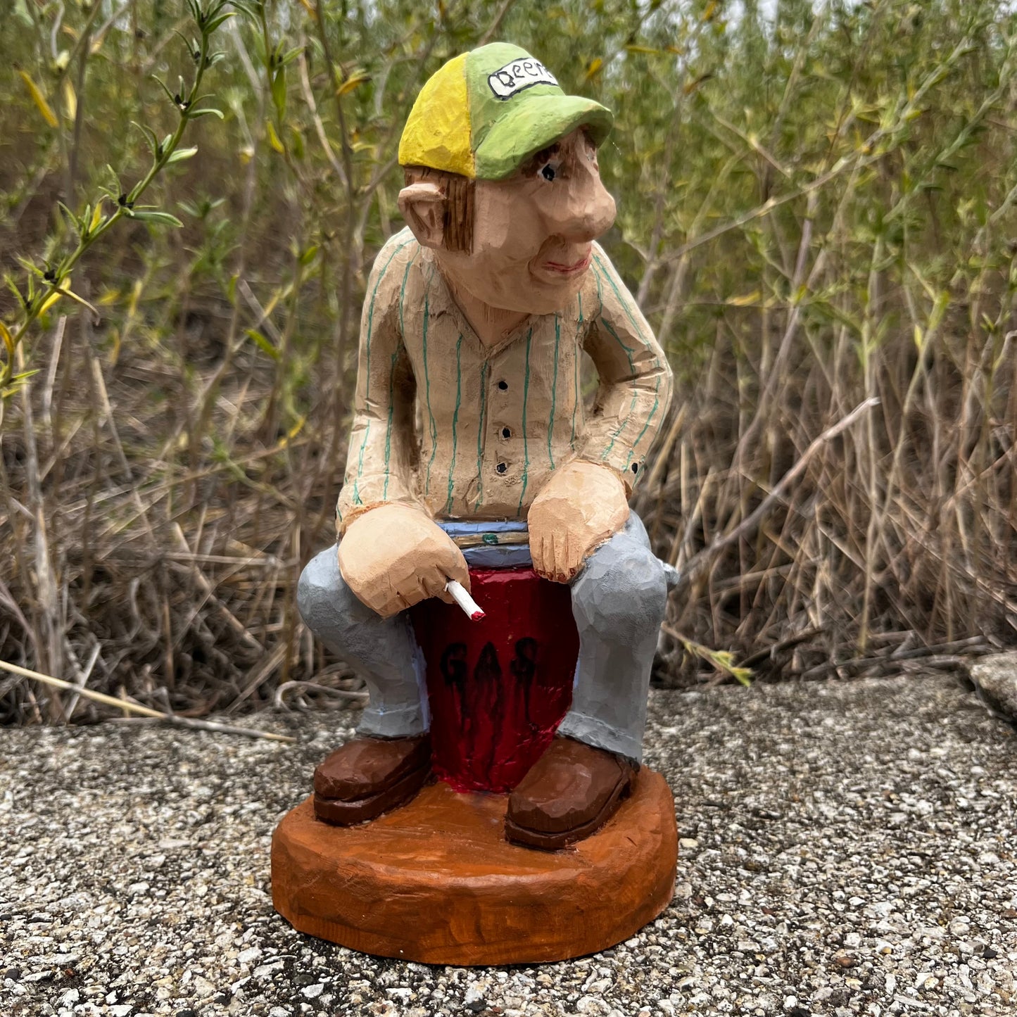 2021 Hand carved gas station attendant.
