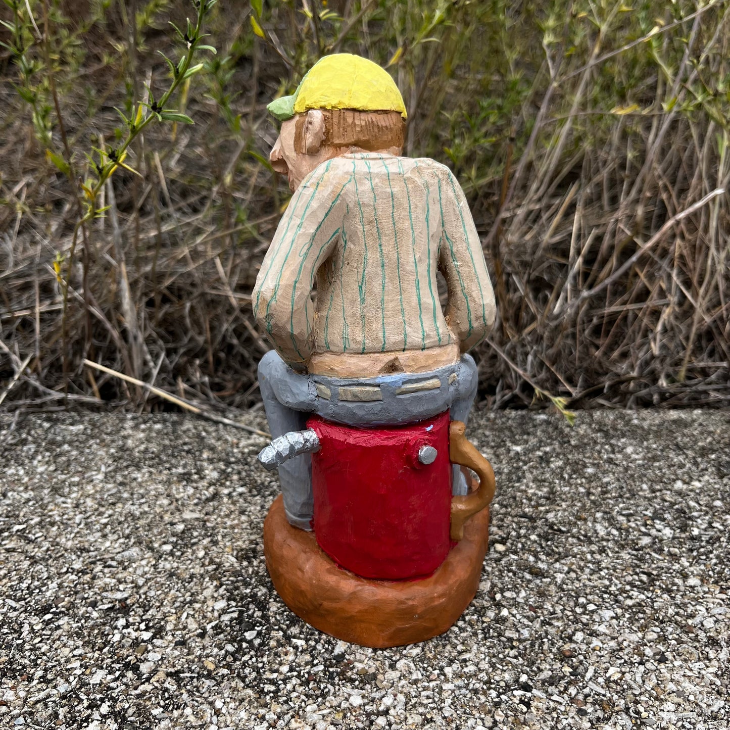 2021 Hand carved gas station attendant.