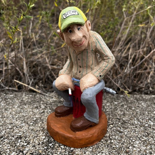 2021 Hand carved gas station attendant.