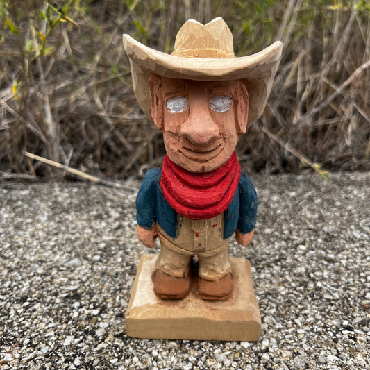 Hand carved blind cowboy.