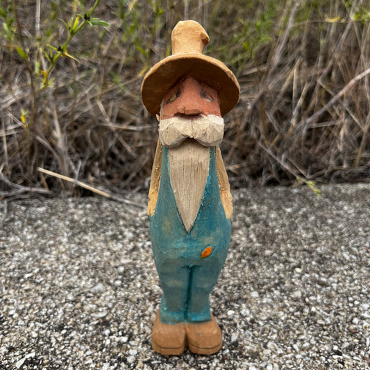 Hand carved moonshiner.