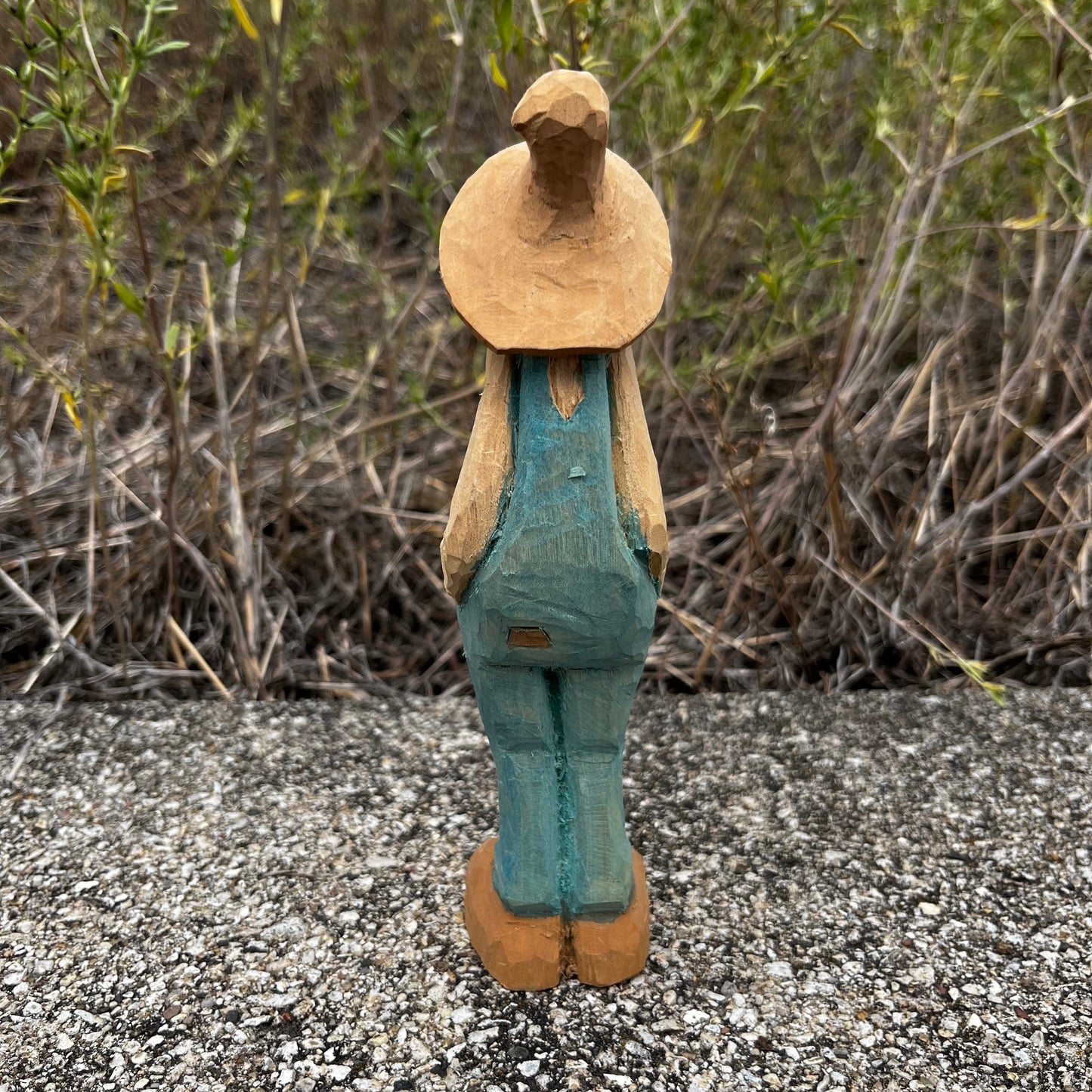 Hand carved moonshiner.