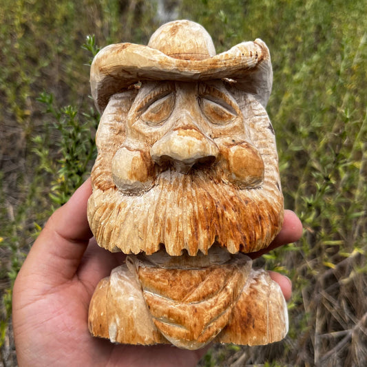 Hand carved wooden cowboy.