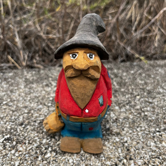 Hand carved moonshiner.