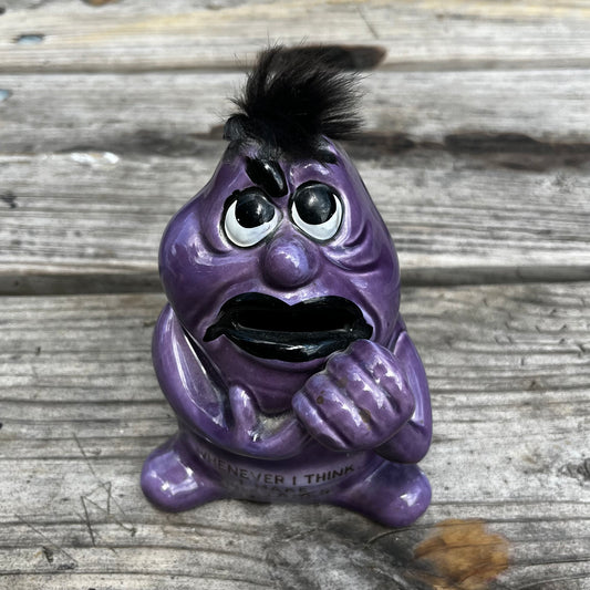 Vintage purple monster coin bank.