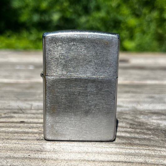 Vintage Zippo flip lighter.