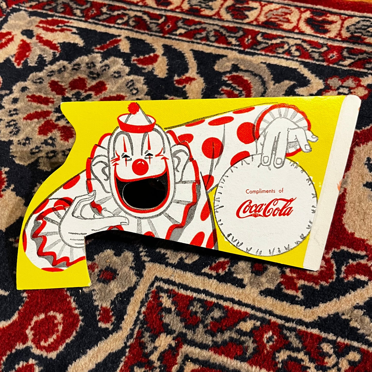 1954 Cardboard circus clown popping pistol.