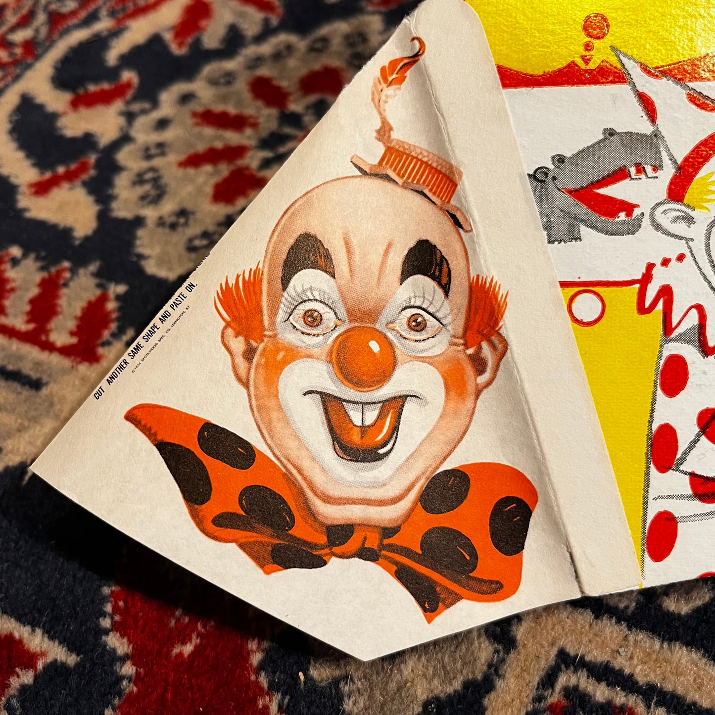 1954 Cardboard circus clown popping pistol.